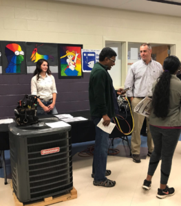 Mike Medlin, HVAC Teacher at Parkwood High School discusses his pathway with an interested parent. 